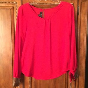 Red blouse with gold embellished cuffs